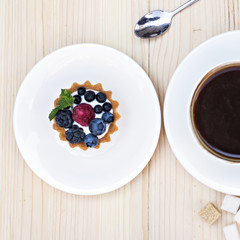 Tart  with Fresh berrie and coffee