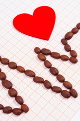Cardiogram line of roasted coffee grains and red heart, medicine and healthcare concept