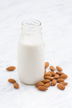 almond milk in a glass bottle, vertical