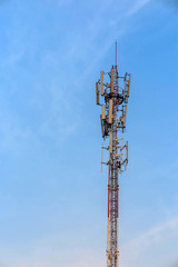 Obraz premium Antenna and telecommunication tower in blue sky background