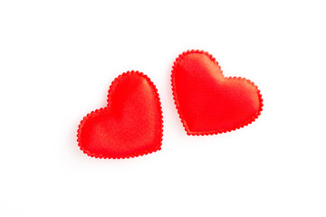 two red hearts on a white background, closeup, isolated