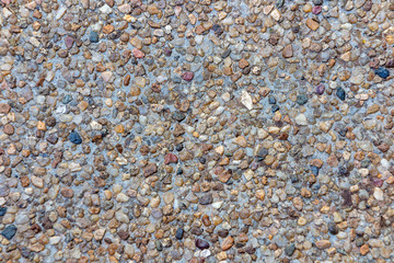 Mixed color stone background in red brown blue black grey color