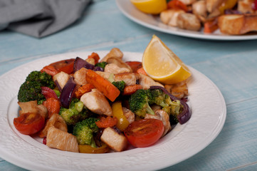 chicken with vegetables cooked on the grill