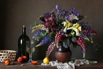 Still life with a bouquet of lupines and irises. © Masquerade