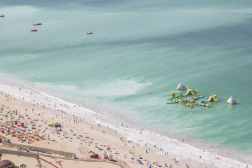 Fototapeta premium background landscape beach in Dubai Marina with holiday travelers and waves on the Gulf