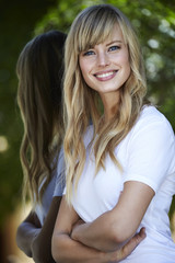 Beautiful young woman looking at camera