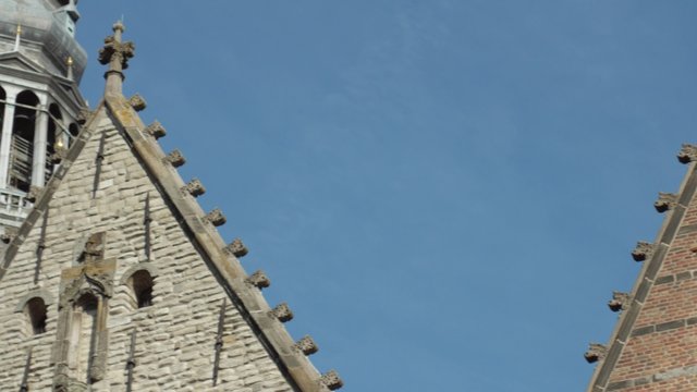 Pan to the spire of De Oude Kerk in Amsterdam Shot in 4K