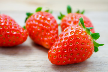 Fresh strawberries on wooden background