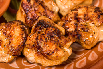 Closeup of grilled chicken thighs.