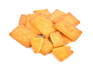 Cookies crackers biscuits sprinkled with sesame on a white backg
