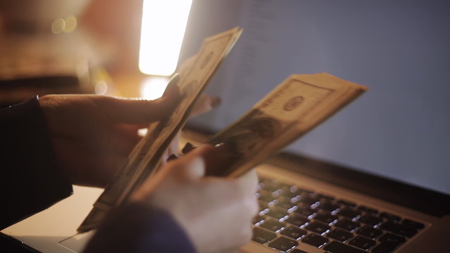 Young business woman counting money