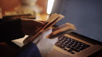 Business woman counts the money in the office