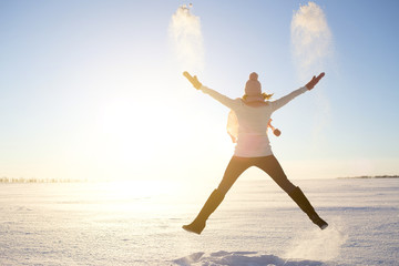 happy girl with a red scarf on the winter