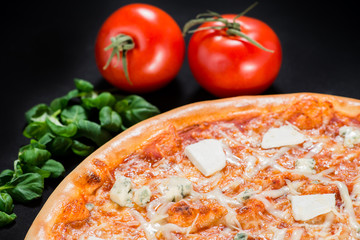 close-up of delicious pizza with different types of cheese on a
