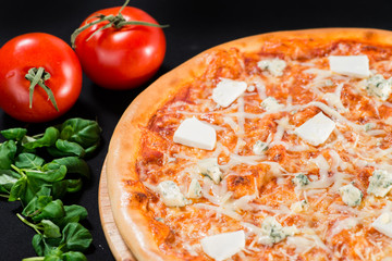 close-up of delicious pizza with different types of cheese on a
