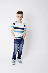 Confident young kid in studio shot