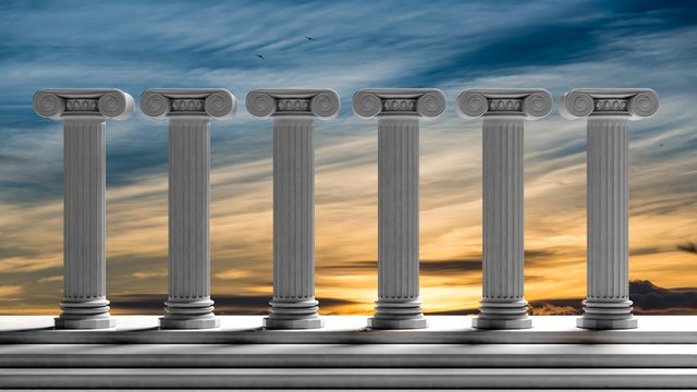 Six ancient pillars with sunset sky background.