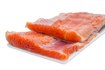Fillet of rainbow trout on a light background
