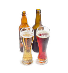 Two beer glasses and two bottles of various beer