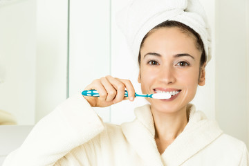 Woman brushing teeth