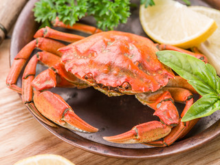 Cooked crab with lemon and herbs.