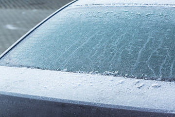 Frozen rear windshield in the car at winter