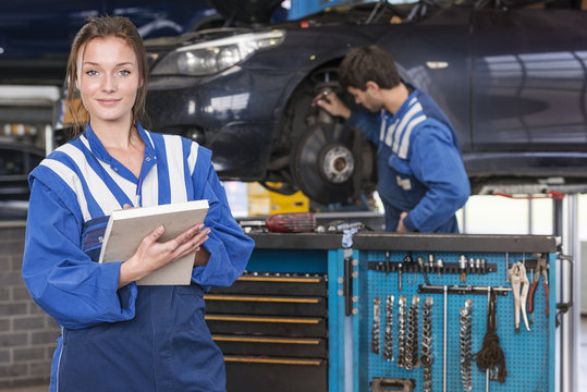 female mechanic in car garage