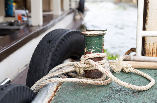 Boat rope tied to the old iron cleats