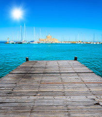 Fototapeta premium wooden bridge juts out into of the sea