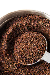 Ground coffee with spoon vertical