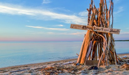 Welcome To The Beach. Driftwood beach hut with handwritten welcome sign. Port Crescent State Park. Port Austin, Michigan.