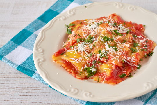 Ravioli with tomato sauce and parmesan cheese