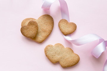 Sweet cookies in the shape of hearts for Valentine's Day on a pi