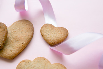Sweet cookies in the shape of hearts for Valentine's Day on a pi