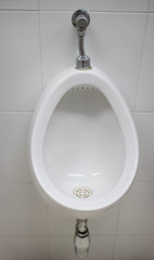 white urinals men in public toilets