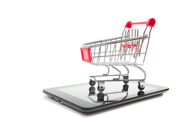 Online shopping concept - Empty Shopping Cart, laptop and tablet pc, smartphone isolated on white background. Copy space for text.