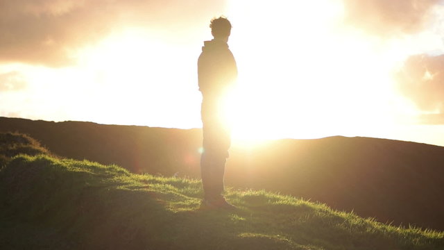 Caucasian Man Staring Into The Sunset, While Seagulls Flying In The Background