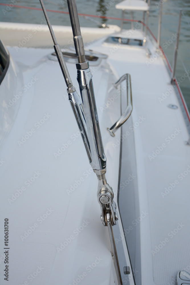 Wall mural close up of stainless turnbuckle tension on luxury boat