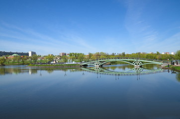 MOSCOW, RUSSIA - MAY 7, 2015: Pedestrian bridge and light and music fountain in Tsaritsyno Park