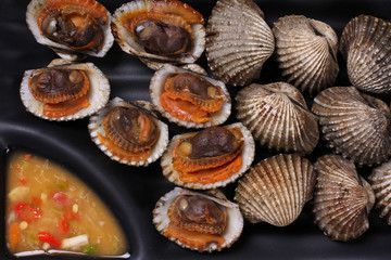 Cockle grill with dipping spicy sour sauce dipping.