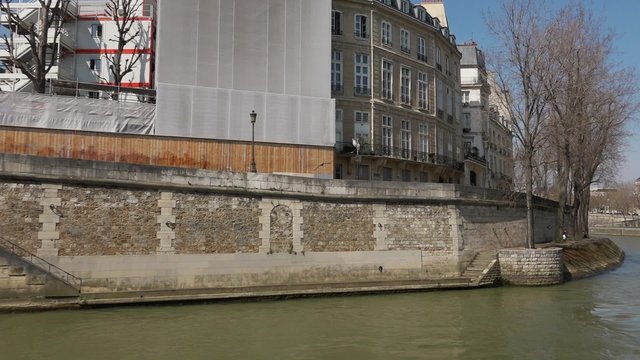 Ile de la Cite cruise Seine river, Paris - Vehicle shot. Ile de la Cite with people along the Seine River, Paris. Vehicle shot - 1080p