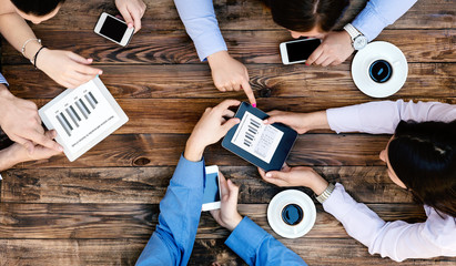 From above View of Business Team with Gadgets interacting