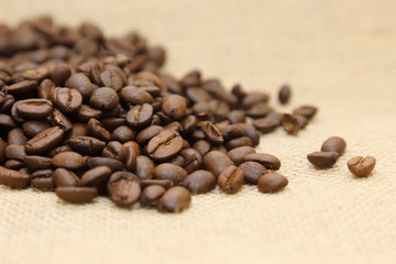Fototapeta na wymiar background of coffee beans on a burlap sack