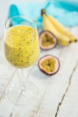 Vibrant yellow banana-passion fruit drink