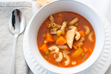 vegetable and pasta soup on a white background