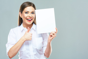 Business woman show thumb up. Smiling model hold blank board