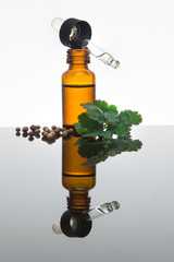 Coriander essential oil bottle (open) with dropper, coriander le