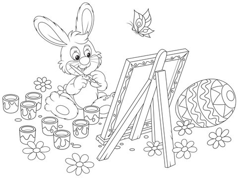 Black and white vector illustration of a happy little rabbit drawing a decorated Easter egg on his canvas