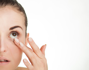 Woman touching her eye concept of healthcare