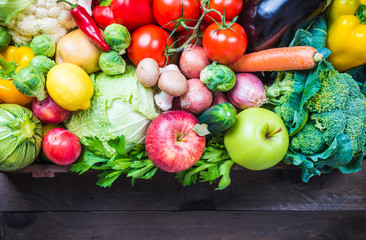 Vegetables and fruits in box, text space.